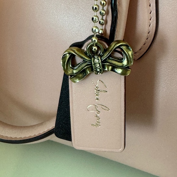EUC Selena Gomez Coach Purse with bowtie charm - Picture 9 of 10